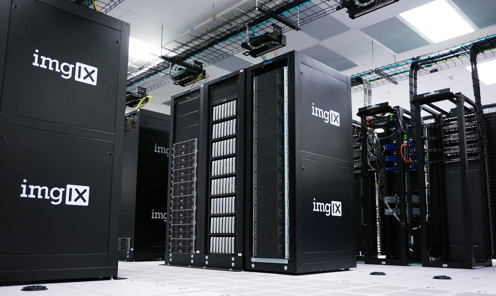Rows of black server racks in a data center